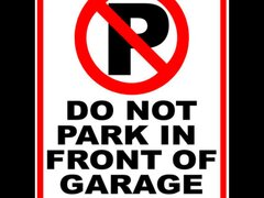 Do Not Park in Front of Garage Door Sign